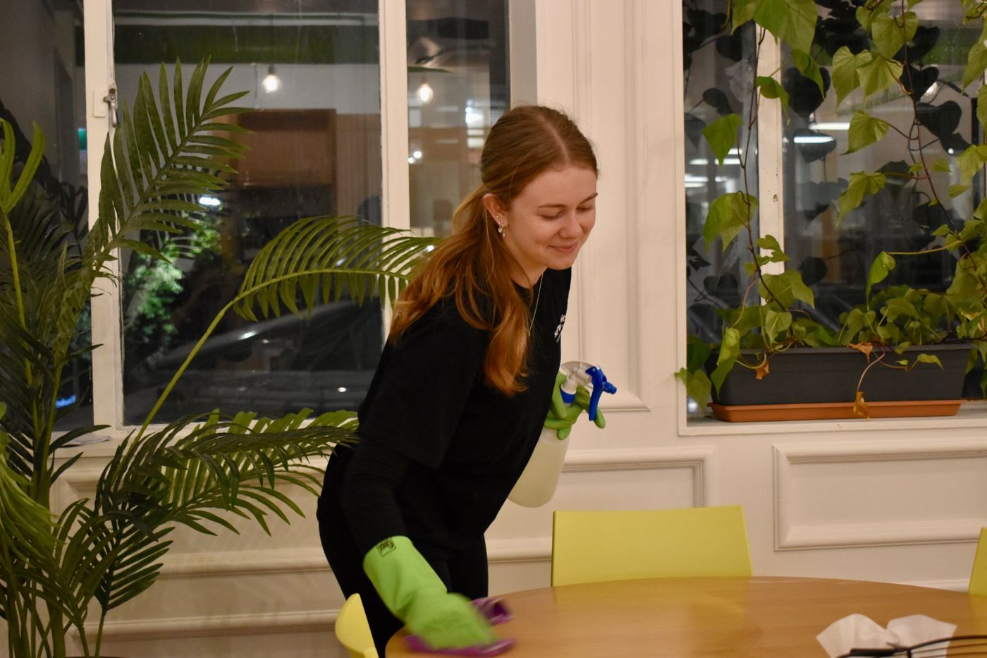 Scrubbies cleaner wiping down a meeting table