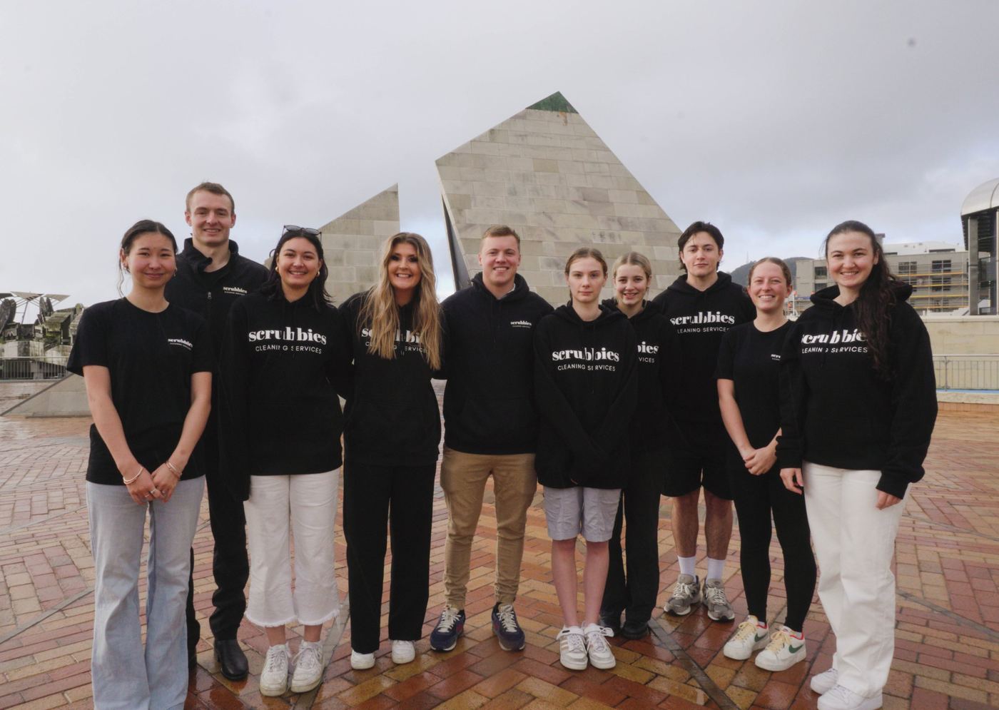 The Scrubbies team in branded hoodies and tees on the Wellington waterfront